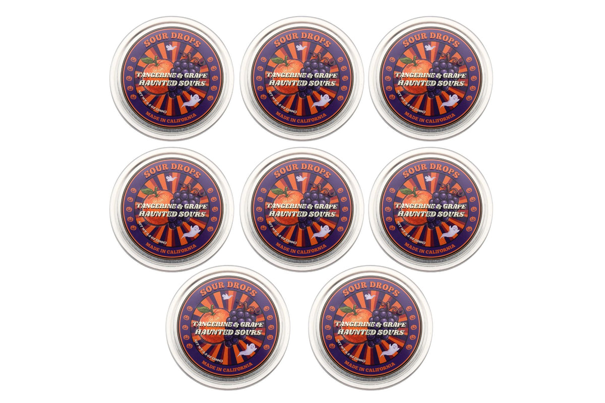 Eight Tangerine & Grape Haunted Sours tins arranged together, the 8-Tin Party Pack of dye-free Halloween sour candy